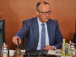 german chancellor friedrich merz rings the bell as he starts the cabinet meeting at the chancellery in berlin germany wednesday april 1 2026