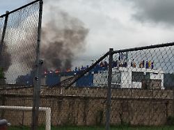 inmates gather on the rooftop of the barinas judicial internment center injuba during a riot in barinas venezuela may 24 2026 picture taken with a mobile phone