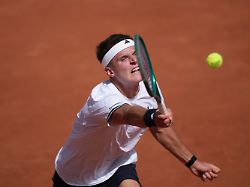 jakub mensik of the czech republic returns to titouan droguet of france during their first round men s singles tennis match at the french open tennis tournament in paris sunday may 24 2026
