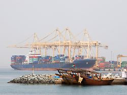 khor fakkan uae large cargo ships docked to load and unload goods at khor fakkport 10104348