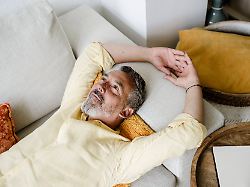 mature person relaxing and daydreaming on sofa at home indoors model released symbolfoto property released knsf12075