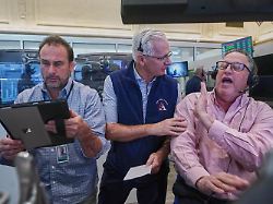 options trader left to right scott frinzi dave rushand and marty handler work on the floor of the new york stock exchange friday may 1 2026