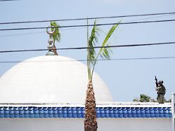 police stage on a roof at the scene of a shooting outside the islamic center of san diego monday may 18 2026 in san diego 1