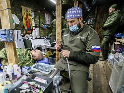 russia kherson region february 19 2026 a dentist of the pobratim medical centre treats a serviceman in the zone of russia s special military operation