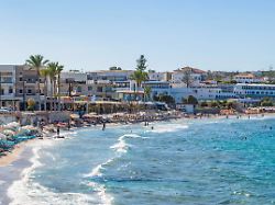 relaxing beach day at akti navarchou nearchou beach in limenas chersonisou crete with sun sand and sea activities