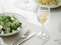 salad and glass of water on a table in a restaurant publicationxinxgerxsuixautxhunxonly ahsf00358