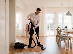 businessman cleaning his home before working from home norrtaelje sweden publicationxinxgerxsuixautxonly crrabe191120b 241729 01