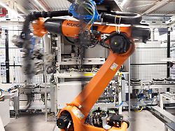 a kuka robot assembles axial flux motors for electric vehicles on an assembly line at the mercedes benz engine factory in berlin germany june 9 2026
