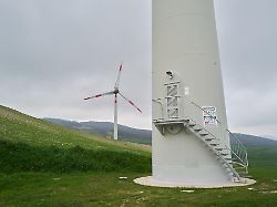 a wind turbine tower with an access door and stairs is seen in a rural area near deliceto italy on march 7 2026 illustrating details of wind energy infrastructure 1