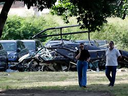 helicopter wreckage lies at a car dealership parking lot where according to police two helicopters collided in midair and crashed in rio de janeiro brazil sunday june 14 2026