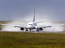 june 13 2026 leeds yorkshire uk leeds uk an ryanair aircraft is engulfed in water as it lands in the rain 35mph wind gusts this morning at leeds bradford airport in yorkshire