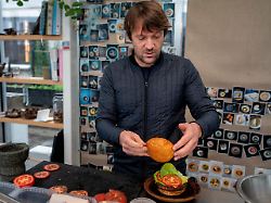 noma s chef rene redzepi prepares a vegetarian burger in a restaurant in copenhagen nov 24 2024