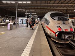 passengers walk at a platform of the main train station in munich germany june 23 2026 after the german rail operator deutsche bahn cancelled trains in germany following a nationwide train radio outage