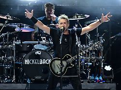 chad kroeger front of nickelback performs during a concert sunday aug 3 2025 at the pro football hall of fame in canton ohio