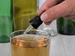 concept of pouring ghb into a glass with a pipette