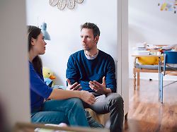 couple having a serious conversation at home in the living room model released symbolfoto property released knsf11203