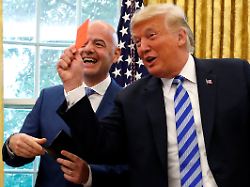 file photo u s president donald trump holds up a red card as he meets with fifa president gianni infantino in the oval office of the white house in washington u s august 28 2018
