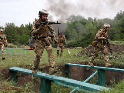 in this photo provided by ukraine s 65th mechanized brigade press service soldiers practice military skills at a training ground near the frontline in the zaporizhzhia region ukraine friday july 24 2026