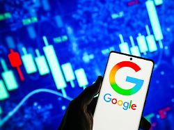 july 22 2026 ahmedabad gujarat india in this photo illustration the google logo is prominently displayed on a smartphone screen with a stock market display in the background