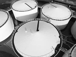 liquid or gas storage silos heavy industry industrial tank container top down aerial drone view