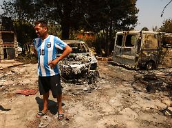 luis gonzalez stands amidst burned and damaged property in the village of el tiemblo as wildfires continue to affect the provinces of avila and madrid spain july 28 2026
