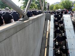 members of the group patriot front use an escalator to access the eastern market metro on the 250th anniversary of u s independence in washington d c u s july 4 2026