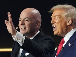 president donald trump and fifa president gianni infantino react during the draw for the 2026 soccer world cup at the kennedy center in washington friday dec 5 2025 1