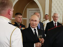 russian president vladimir putin center toasts during a meeting with naval officers on navy day at the admiralty building in st petersburg russia on sunday july 26 2026