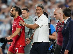 switzerland head coach murat yakin and switzerland s ricardo rodriguez 13 react after the world cup quarterfinal soccer match between argentina and switzerland in kansas city mo saturday july 11 2026