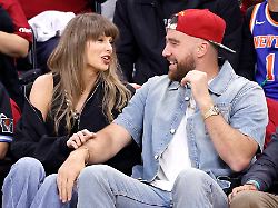 taylor swift and travis kelce talkd during the first quarter of the cleveland cavaliers eastern conference final game against the new york knicks in cleveland ohio saturday may 23 2026