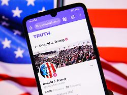 us president donald j trump official truth account is displayed on a mobile phone screen with u s flag in the background for illustration photo krakow poland on february 20th 2025