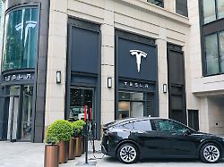 a tesla store in shanghai east china offers charging services on 19 may 2026