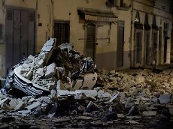 a car crushed by rubble stand on a debris covered via pergolesi after a magnitude 4 7 earthquake struck the campi flegrei area in pozzuoli italy july 31 2026