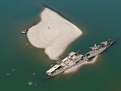 a drone view shows people swimming near a sunken german warship from world war ii exposed due to low danube river levels caused by drought and extreme heat in prahovo serbia july 30 2026