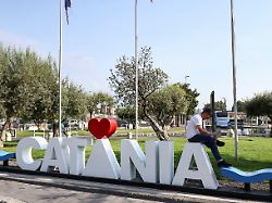 a man sits outside the vincenzo bellini catania airport following the closure of the airport due to an ash cloud from sicily s mount etna eruption in catania italy august 14 2026