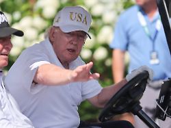 bedminster nj august 09 president donald trump drives in a golf cart at bedminster before the forth round of liv golf new york on august 9 2026 at trump national golf club in bedminster new jersey