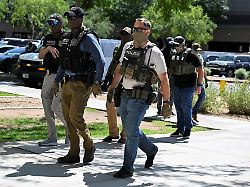 file photo masked law enforcement officers including hsi and ice agents walk into an immigration court in phoenix arizona u s may 21 2025