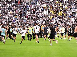 fans storm the pitch during the pre season friendly soccer match between juventus and juventus next gen at the allianz stadium in torino north west italy wednesday august 17 2026 soccer