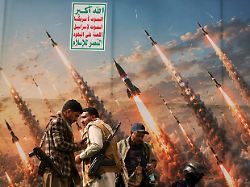 houthi activists stand on a platform against a banner depicting houthi missiles at an anti saudi rally amid an escalation with the kingdom in sanaa yemen july 31 2026