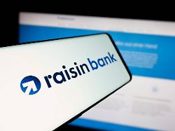 illustrative editorial images in germany 20 mar 2025 in this photo illustration a smartphone with the logo of german financial company raisin bank ag is seen on screen in front of website