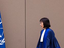 judge tomoko akane walks before delivering the verdict in the al hassan case at the international criminal court in the hague netherlands wednesday nov 20 2024