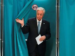 kazakh president kassym jomart tokayev walks out of a voting booth at a polling station during a snap parliamentary election in astana kazakhstan august 23 2026