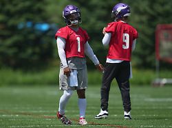 minnesota vikings quarterbacks kyler murray 1 and j j mccarthy 9 stand on the field during an nfl football practice tuesday june 9 2026 in eagan minn