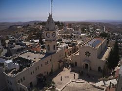 palestinian parishioners stand outside christ the redeemer church after attending a morning mass in the west bank village of taybeh sept 28 2025