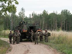 servicemen of the latvian national guard gather before a search operation for the debris from an intercepted drone amid russia s attack on ukraine in rugaji latvia august 14 2026
