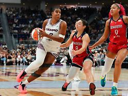 toronto tempo s nyara sabally left drives at washington mystics georgia amoore 8 and shakira austin 0 during the first half of a wnba basketball game in toronto tuesday july 14 2026