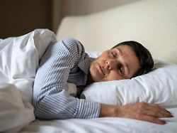 tranquil senior woman comfy lying in bed in bedroom at home covered in blanket and sleeping relaxed elderly mature female sleeps with pillow healthcare and mental energy aged lady resting in bed